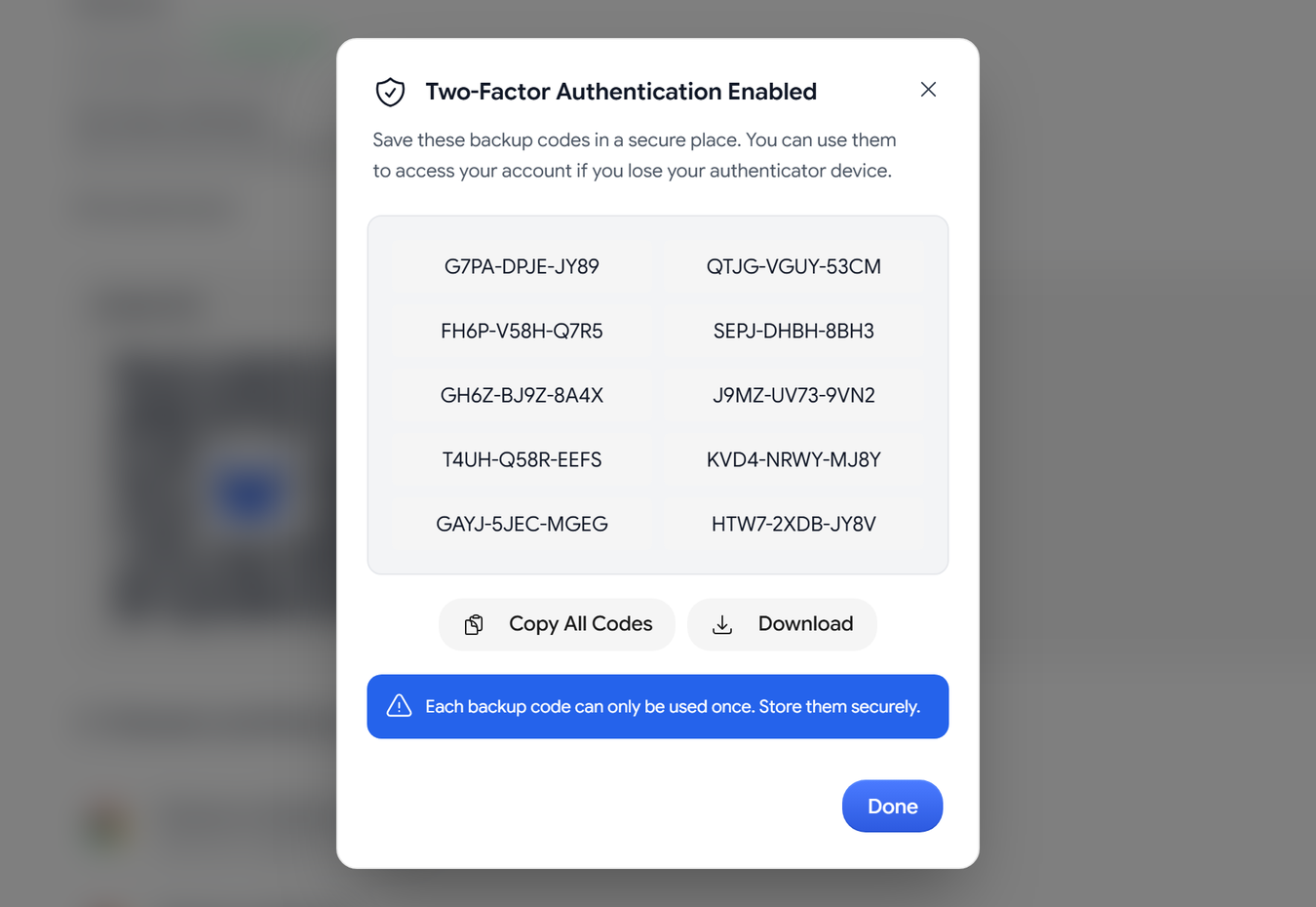 The Two-Factor Authentication Enabled dialog with a list of backup codes